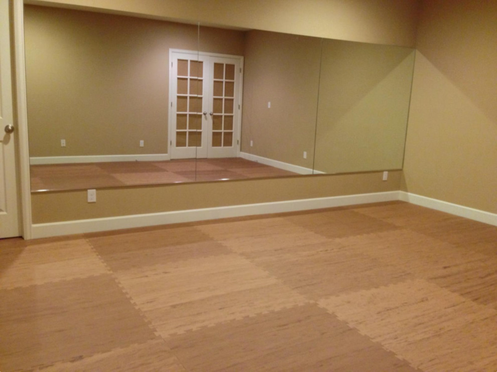 Inspiration for a mid-sized modern home yoga studio in Minneapolis with beige walls.