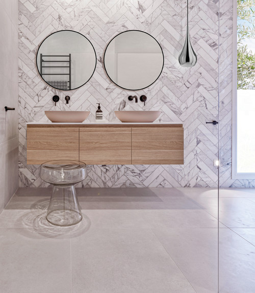 Understated Luxury: Marble Herringbone Tile Backsplash with Light Wood Vanity