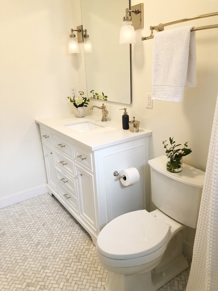 Example of a small transitional master gray tile and marble tile marble floor and gray floor alcove shower design in Providence with furniture-like cabinets, white cabinets, white walls, an undermount sink, marble countertops and white countertops