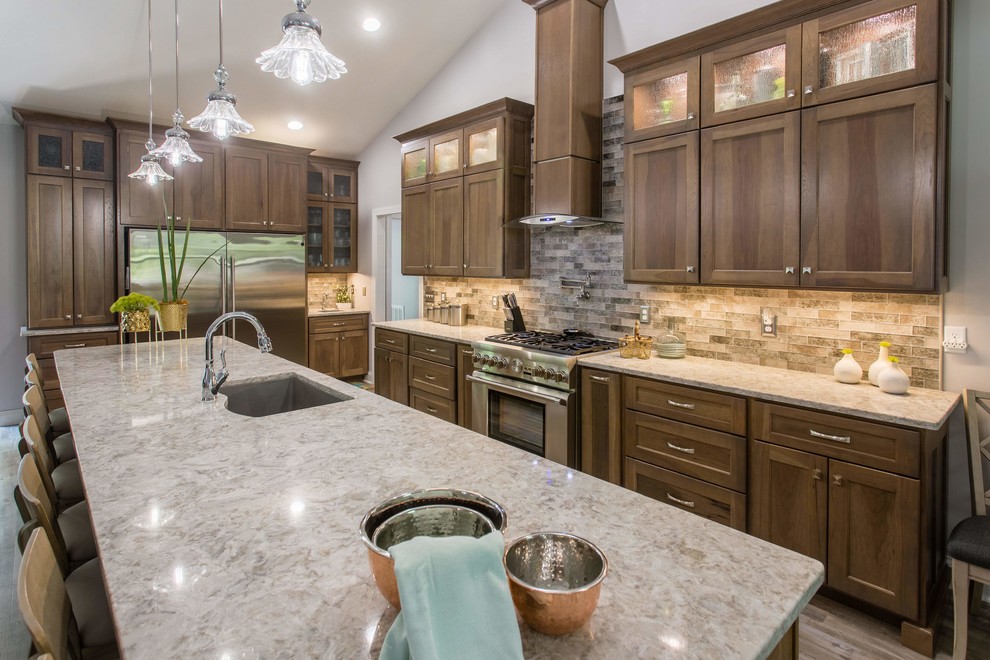 Open concept kitchen - transitional l-shaped open concept kitchen idea with shaker cabinets, stainless steel appliances and an island