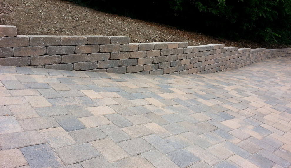 Design ideas for a mediterranean front yard concrete paver driveway in Orange County.