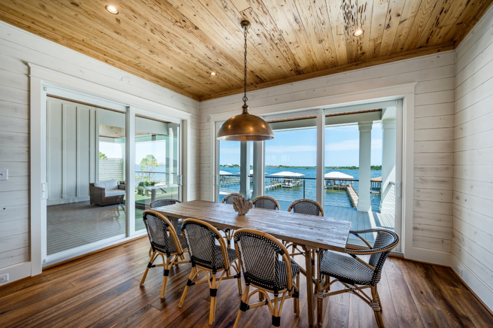 Beach style dining room in Other.