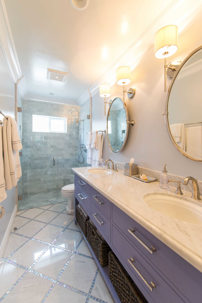 Design ideas for a beach style master bathroom in San Luis Obispo with flat-panel cabinets, purple cabinets, a curbless shower, a one-piece toilet, marble, purple walls, marble floors, a drop-in sink, marble benchtops, grey floor and a hinged shower door.