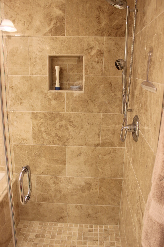 Design ideas for a large mediterranean master bathroom in DC Metro with an undermount sink, raised-panel cabinets, beige cabinets, granite benchtops, a corner shower, a two-piece toilet, brown tile, stone tile, brown walls and travertine floors.