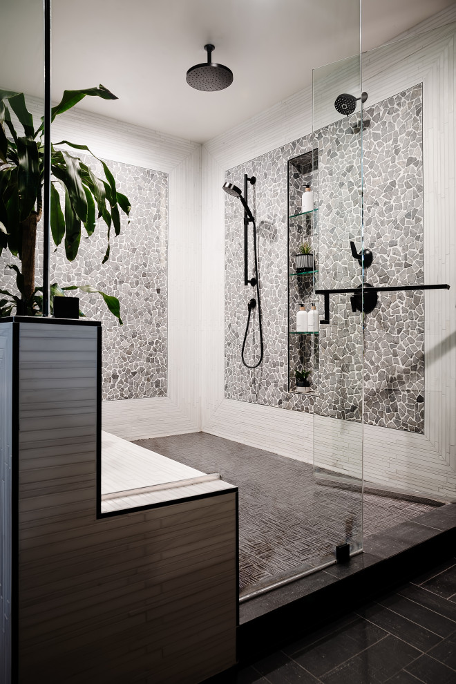 Large traditional bathroom in Los Angeles with black and white tiles and pebble tiles.