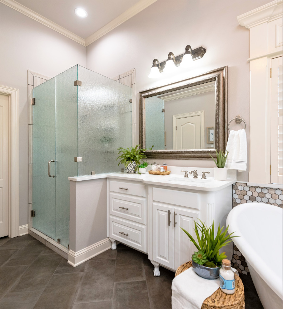 Inspiration for a mid-sized transitional master beige tile and porcelain tile porcelain tile and gray floor freestanding bathtub remodel with raised-panel cabinets, white cabinets, a one-piece toilet, beige walls, an undermount sink, quartzite countertops, a hinged shower door and white countertops