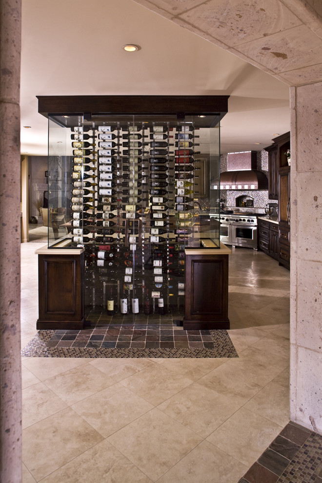 Design ideas for a large wine cellar in Phoenix with limestone floors and beige floor.