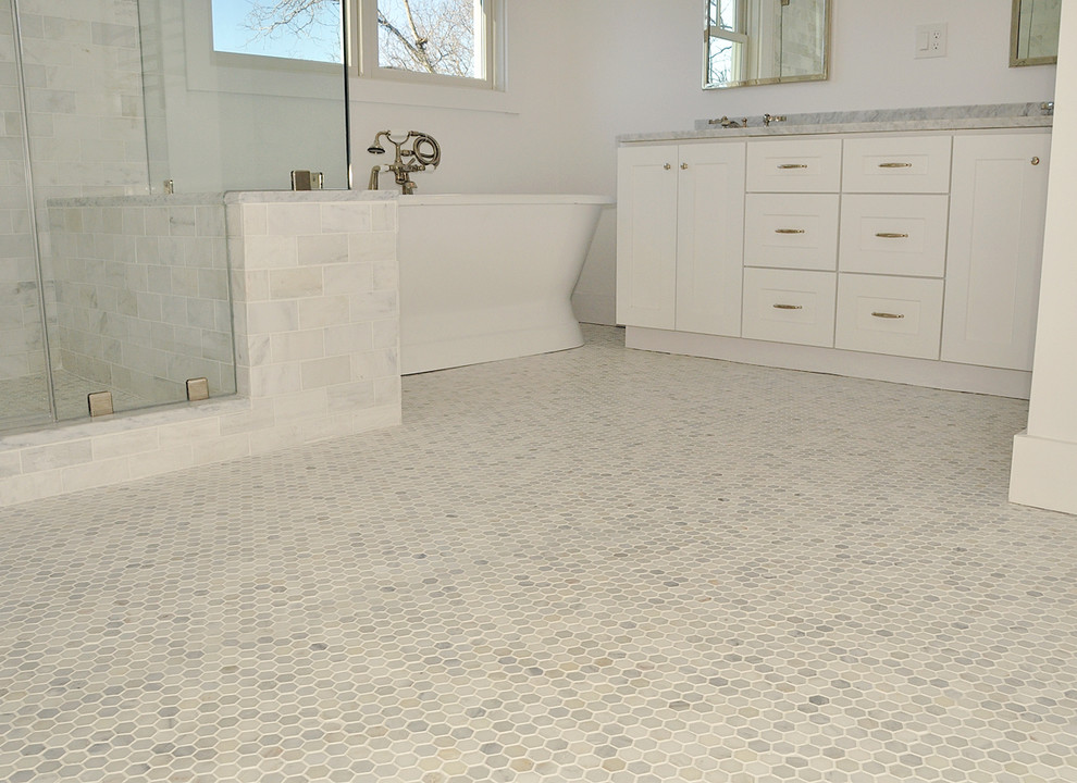Inspiration for a large arts and crafts master bathroom in Boston with shaker cabinets, white cabinets, a freestanding tub, a corner shower, a two-piece toilet, stone tile, white walls, marble floors, a drop-in sink and marble benchtops.