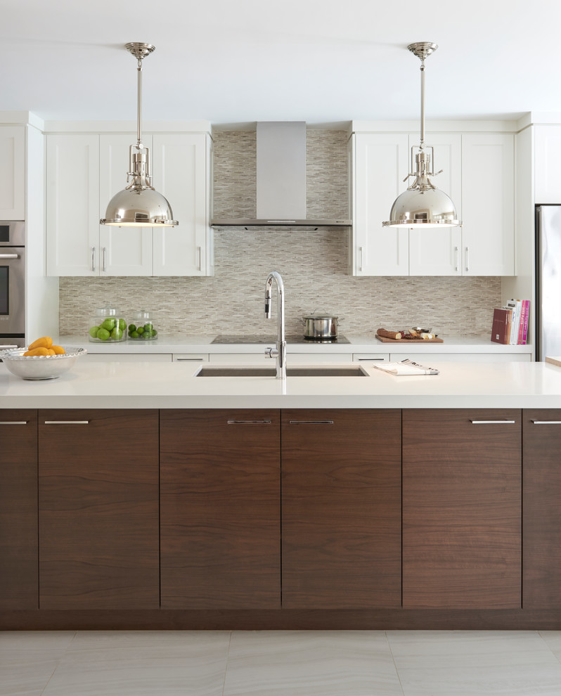 Design ideas for a contemporary galley kitchen in Toronto with shaker cabinets, white cabinets, beige splashback, matchstick tile splashback, with island, beige floor, an undermount sink, stainless steel appliances, porcelain floors, quartz benchtops and white benchtop.