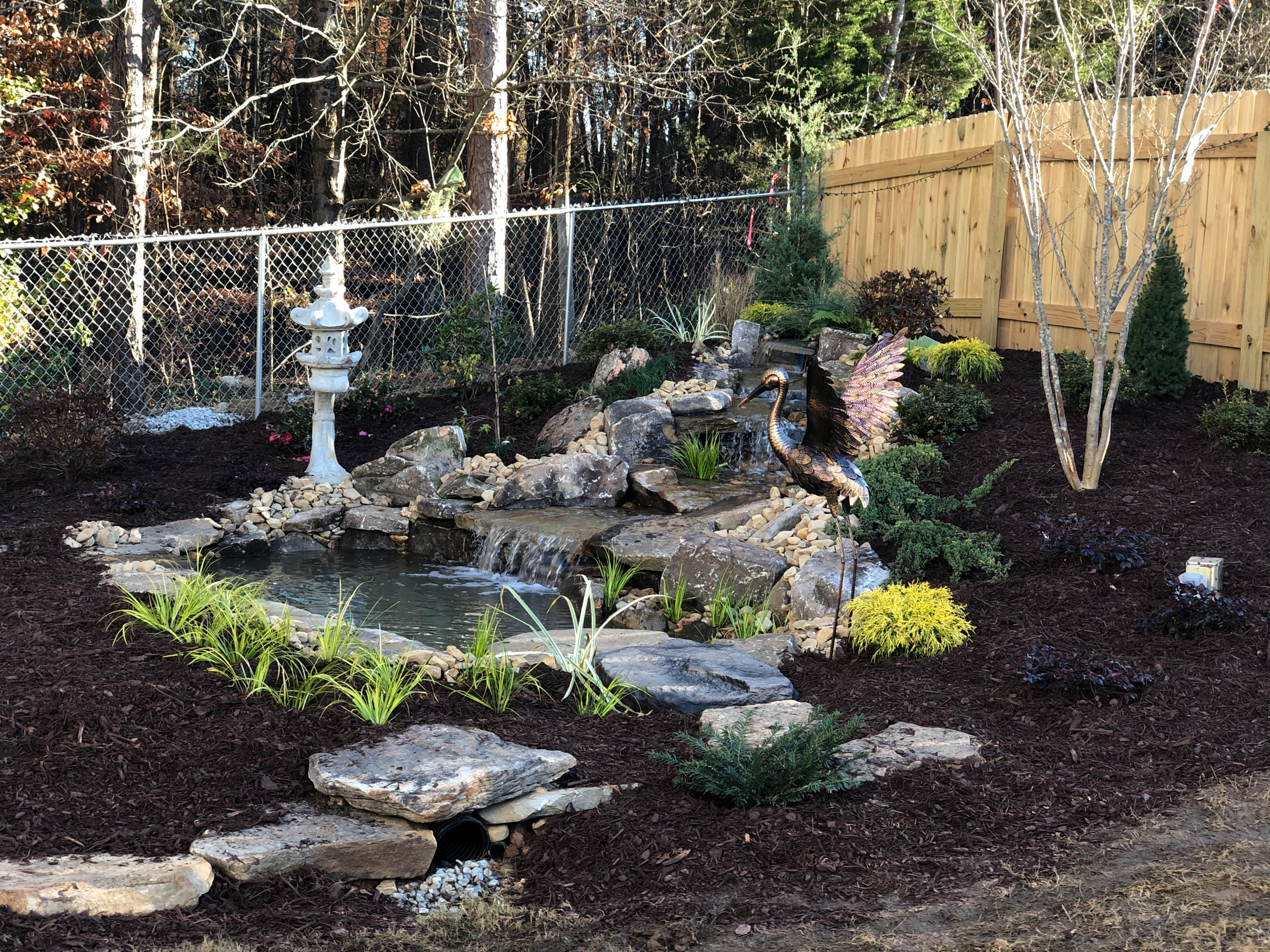 Backyard water feature, how to use the lay of the land to your advantage!