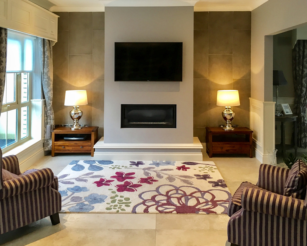 This is an example of a small traditional formal open concept living room in Other with beige walls, porcelain floors, a standard fireplace, a concrete fireplace surround, a wall-mounted tv and beige floor.