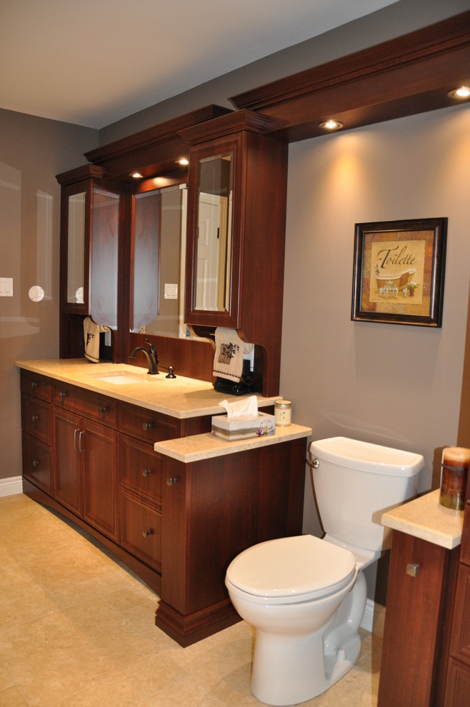 Example of a large transitional master beige tile and ceramic tile ceramic tile home design design in Ottawa with an undermount sink, recessed-panel cabinets, medium tone wood cabinets, granite countertops, gray walls and a one-piece toilet