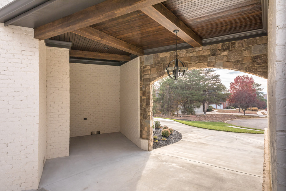 Design ideas for a mid-sized arts and crafts attached two-car porte cochere in Other.