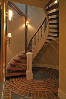 Circular brick pattern in floor accents spiral stair 