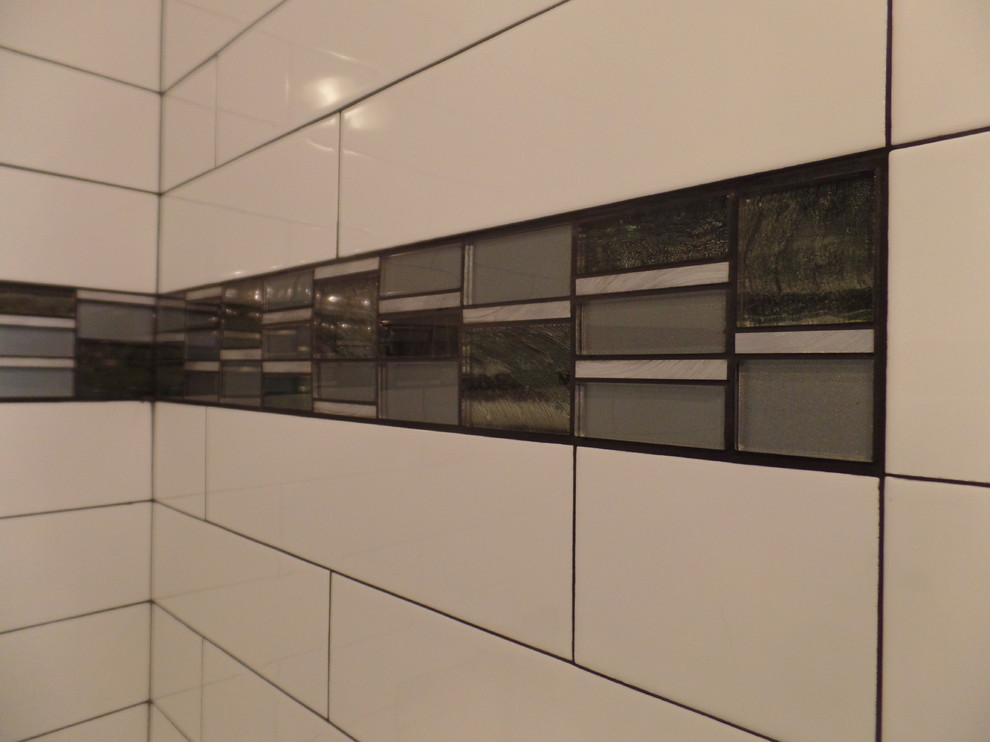 Inspiration for a mid-sized transitional kids' white tile and ceramic tile porcelain tile and gray floor home design remodel with shaker cabinets, green cabinets, a two-piece toilet, gray walls, an undermount sink, marble countertops and a hinged shower door