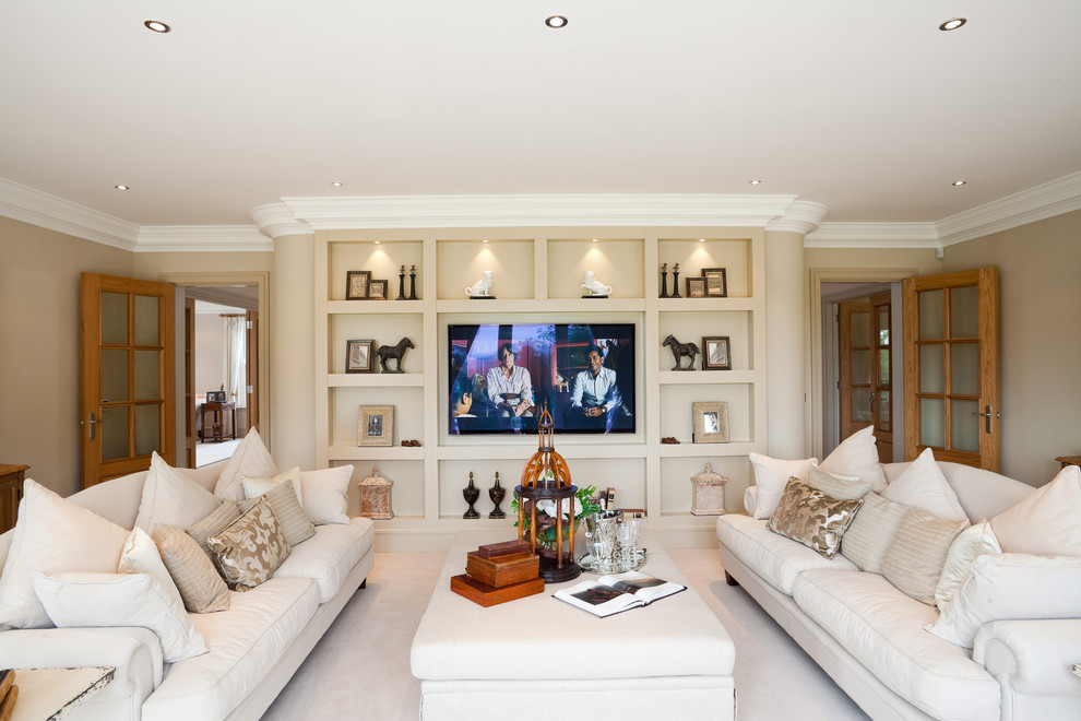 Traditional formal enclosed living room in Berkshire with beige walls, carpet and a wall-mounted tv.