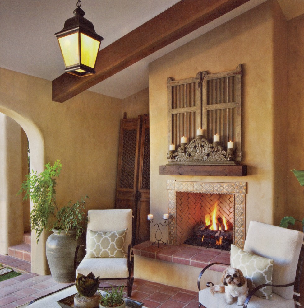 Design ideas for a large mediterranean open concept family room in Phoenix with a library, a standard fireplace and a tile fireplace surround.