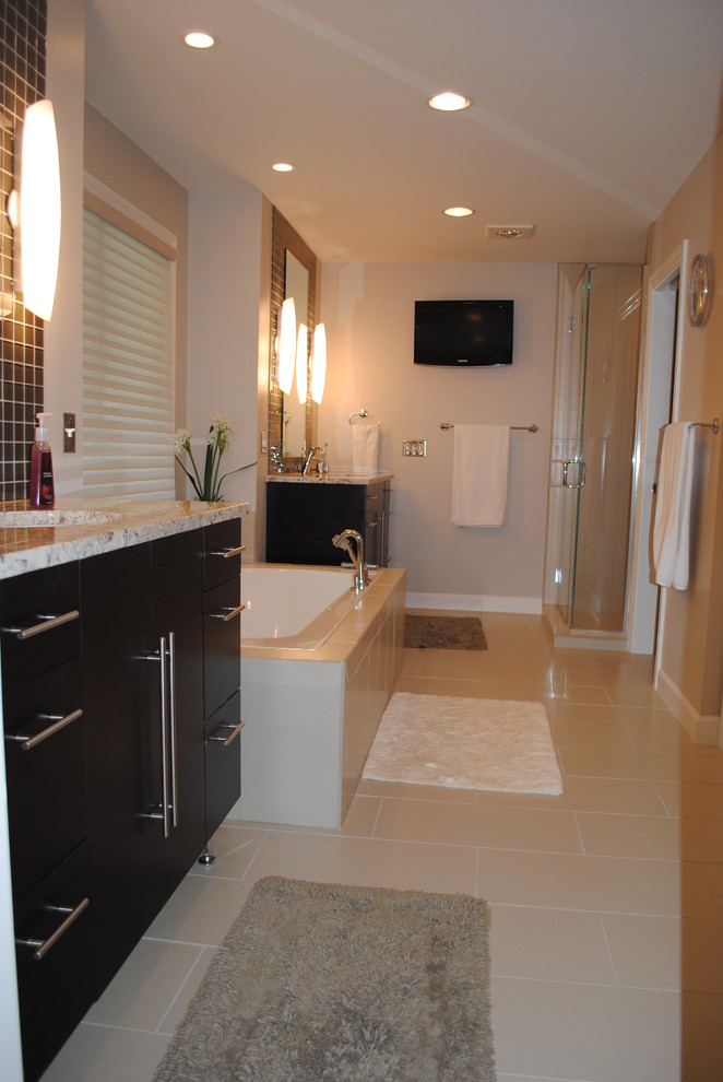 Inspiration for a large traditional master bathroom in St Louis with flat-panel cabinets, dark wood cabinets, an alcove shower, brown tile, glass tile, grey walls, porcelain floors, an undermount sink, granite benchtops, beige floor and a hinged shower door.