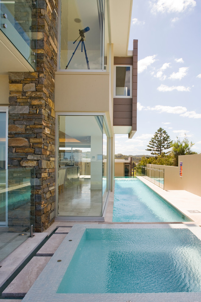 Design ideas for a contemporary rectangular infinity pool in Sydney.