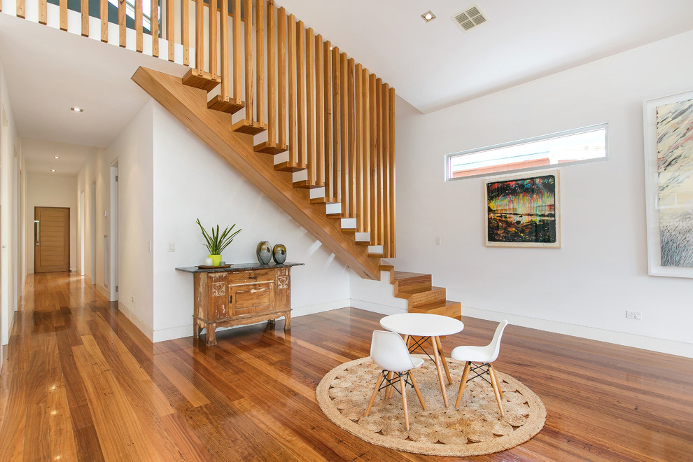 This is an example of a mid-sized contemporary straight staircase in Melbourne.