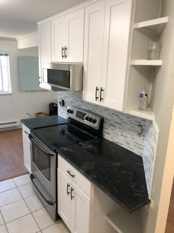 Example of a transitional kitchen design in Seattle
