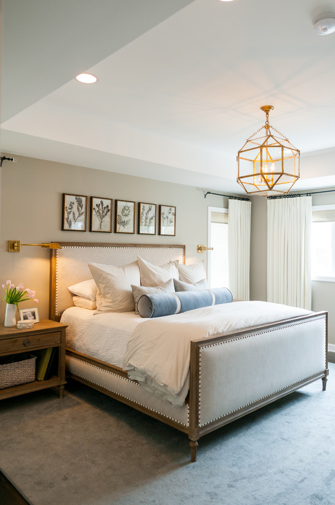 Mid-sized transitional master dark wood floor and brown floor bedroom photo in Detroit with beige walls