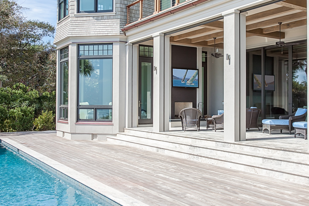 Inspiration for a large beach style backyard patio in Atlanta with decking and no cover.