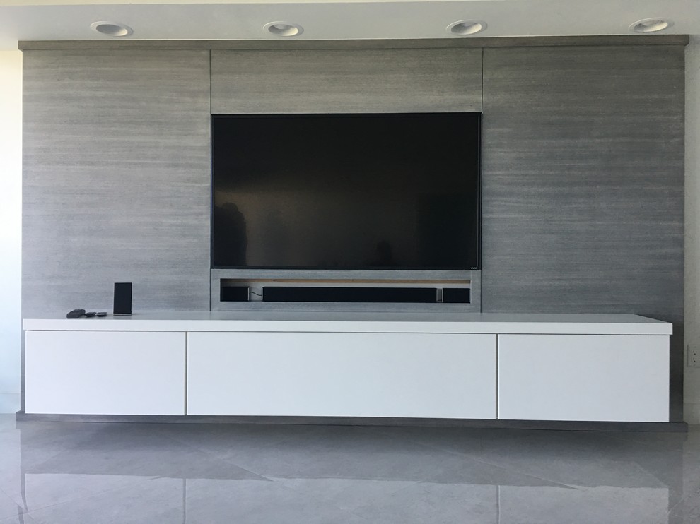 Design ideas for a large contemporary enclosed home theatre in Miami with white walls, marble floors and a built-in media wall.