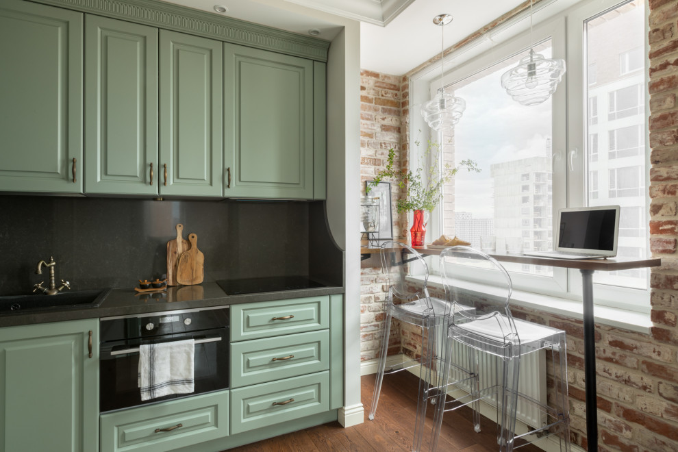 Classic kitchen in Moscow with turquoise cabinets and black splashback.