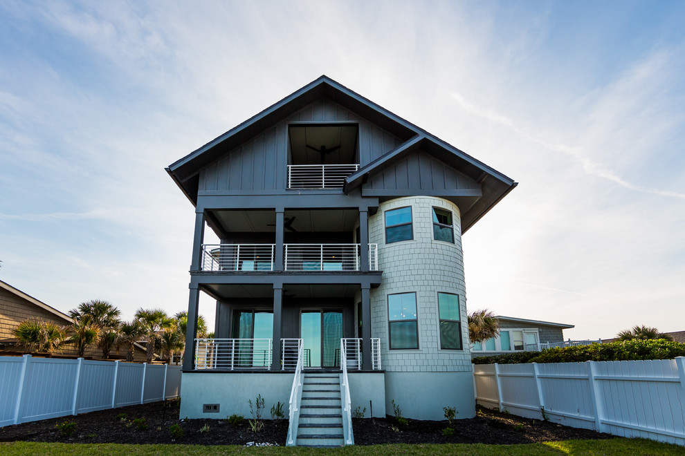 Inspiration for a large beach style three-storey grey exterior in Jacksonville with concrete fiberboard siding.