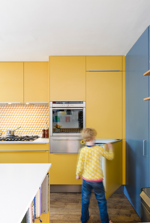 Patterned Tiles and White Countertops in Yellow Kitchen Cabinets - Playful Retro Kitchen Backsplash Ideas