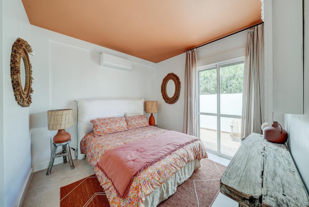 Example of a beach style bedroom design in Malaga