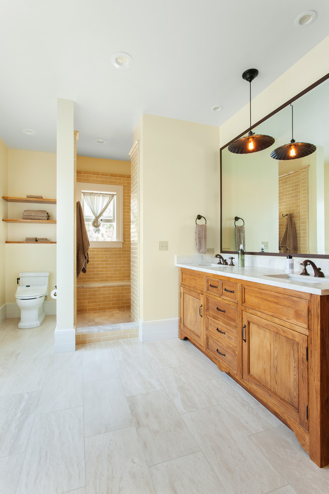 Inspiration for a mid-sized traditional bathroom in San Luis Obispo with an undermount sink, medium wood cabinets, an open shower, a one-piece toilet, beige tile, ceramic tile, ceramic floors, beige walls, recessed-panel cabinets and an open shower.