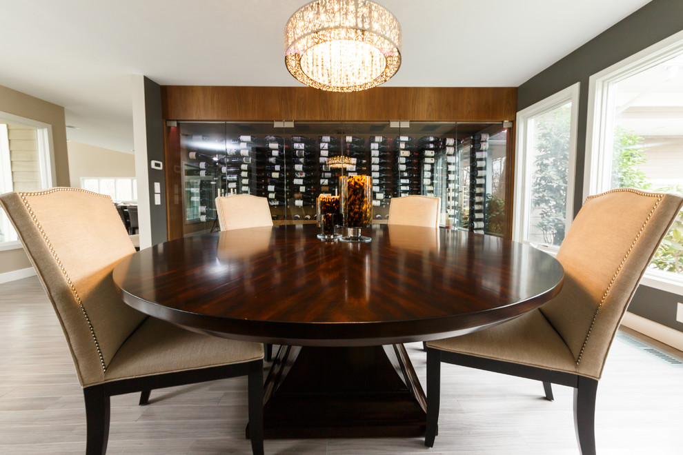 Design ideas for a mid-sized transitional wine cellar in New York with dark hardwood floors and display racks.