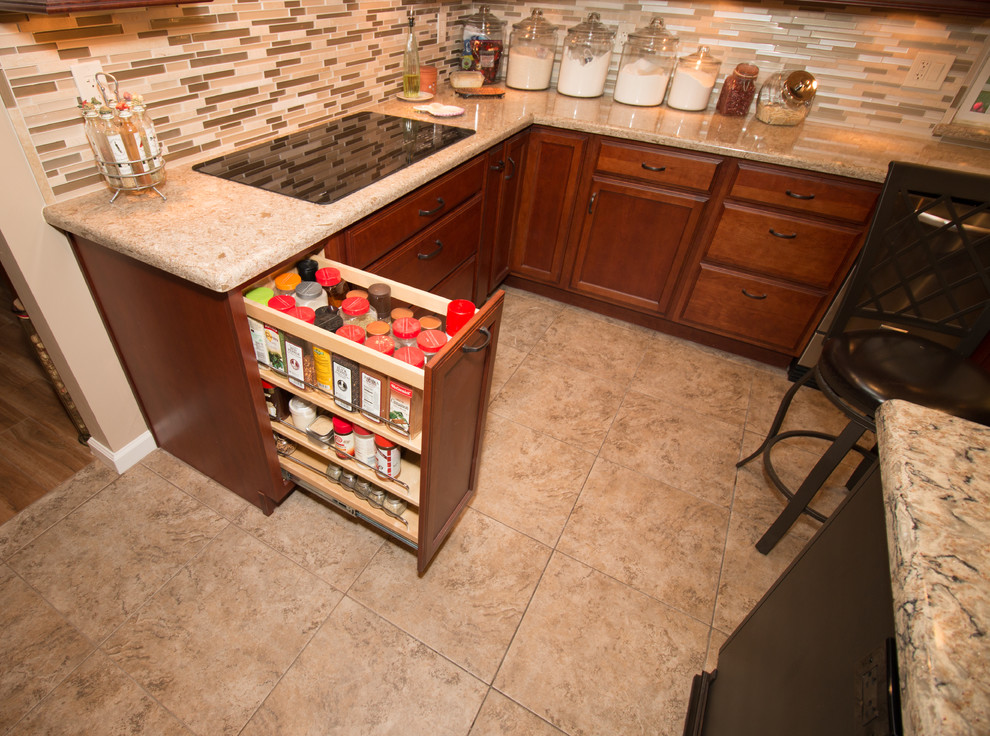 Large transitional u-shaped porcelain tile kitchen photo with an undermount sink, flat-panel cabinets, medium tone wood cabinets, quartz countertops, beige backsplash, mosaic tile backsplash, stainless steel appliances and an island