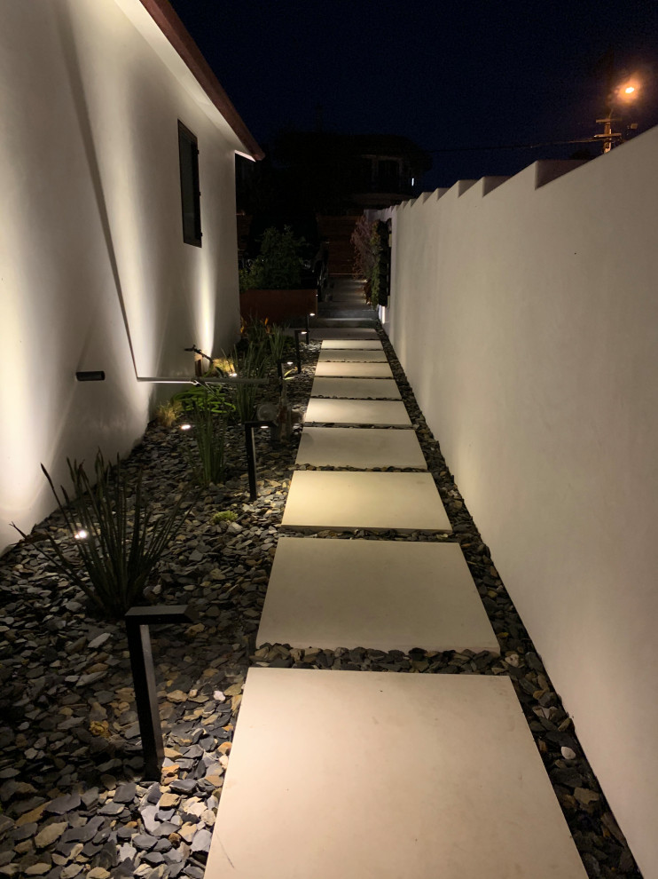 Medium sized scandinavian side partial sun garden for summer in San Diego with a pathway and concrete paving.