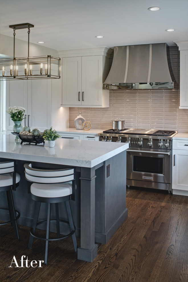 Inspiration for a large transitional l-shaped medium tone wood floor and brown floor kitchen pantry remodel in Chicago with an undermount sink, recessed-panel cabinets, gray cabinets, quartz countertops, gray backsplash, ceramic backsplash, paneled appliances, an island and gray countertops
