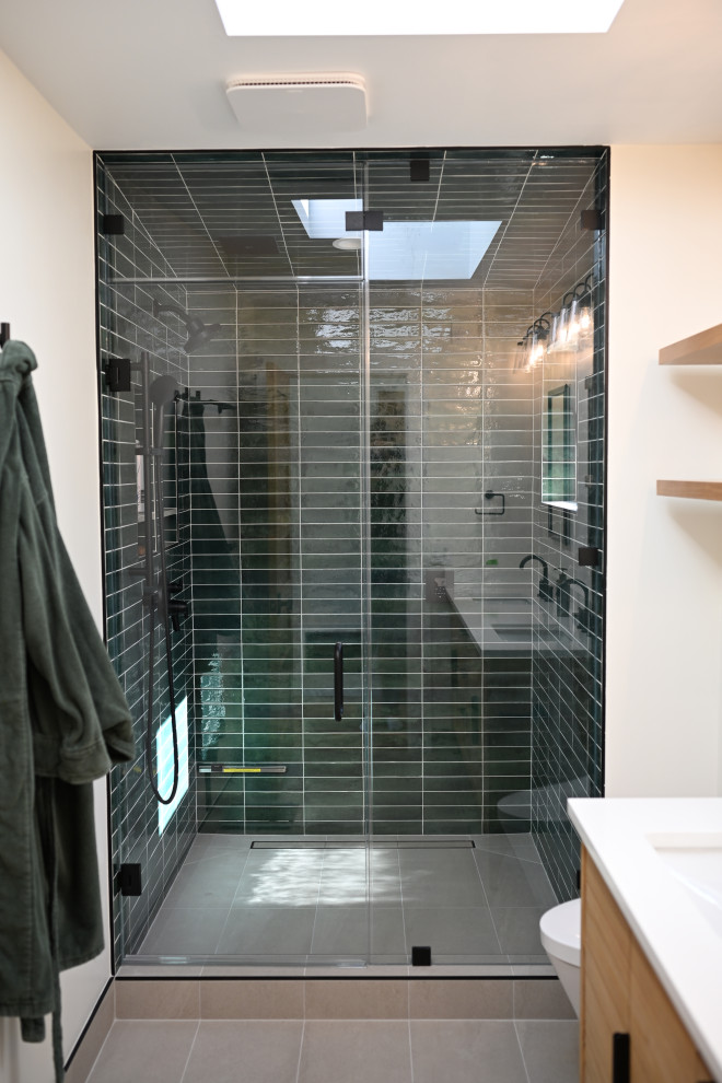 Glossy Green Tile Walk-In Shower with Frameless Glass Enclosure