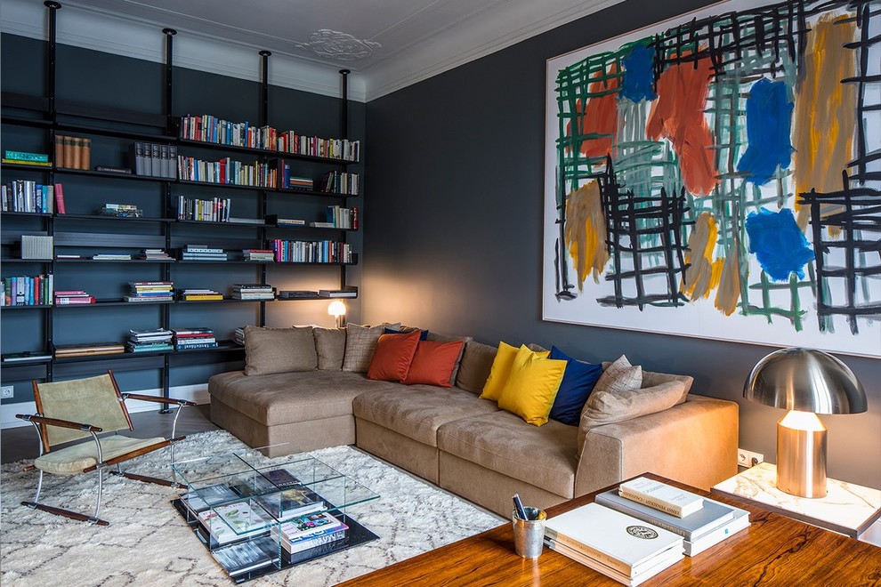 This is an example of a small contemporary enclosed family room in Hamburg with a library, black walls and no fireplace.