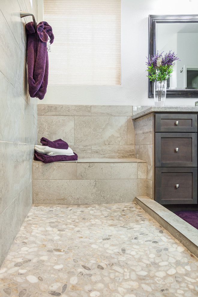 Example of a mid-sized transitional master beige tile and porcelain tile porcelain tile and brown floor alcove shower design in Phoenix with recessed-panel cabinets, dark wood cabinets, a one-piece toilet, orange walls, an undermount sink and granite countertops