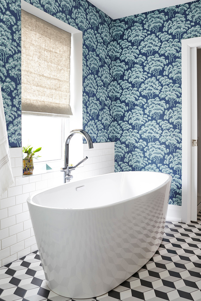 Example of a transitional master mosaic tile floor freestanding bathtub design in Toronto with blue walls