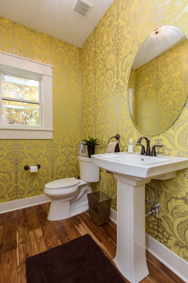 Transitional powder room in Cedar Rapids with a pedestal sink and a two-piece toilet.