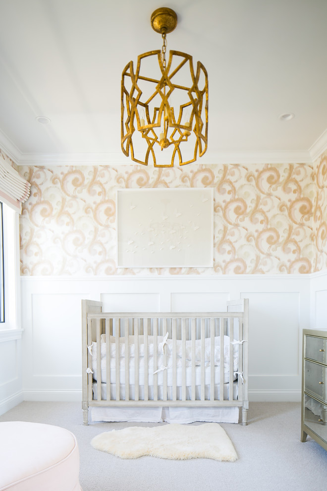 This is an example of a transitional nursery for girls in Orange County with multi-coloured walls, carpet and grey floor.