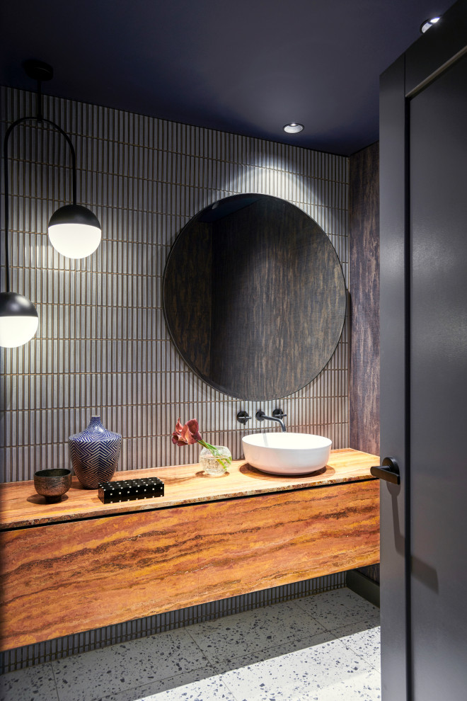 Inspiration for a large contemporary cloakroom in Sydney with flat-panel cabinets, red cabinets, a two-piece toilet, grey tiles, matchstick tiles, blue walls, terrazzo flooring, a vessel sink, travertine worktops, white floors, red worktops, a floating vanity unit and wallpapered walls.