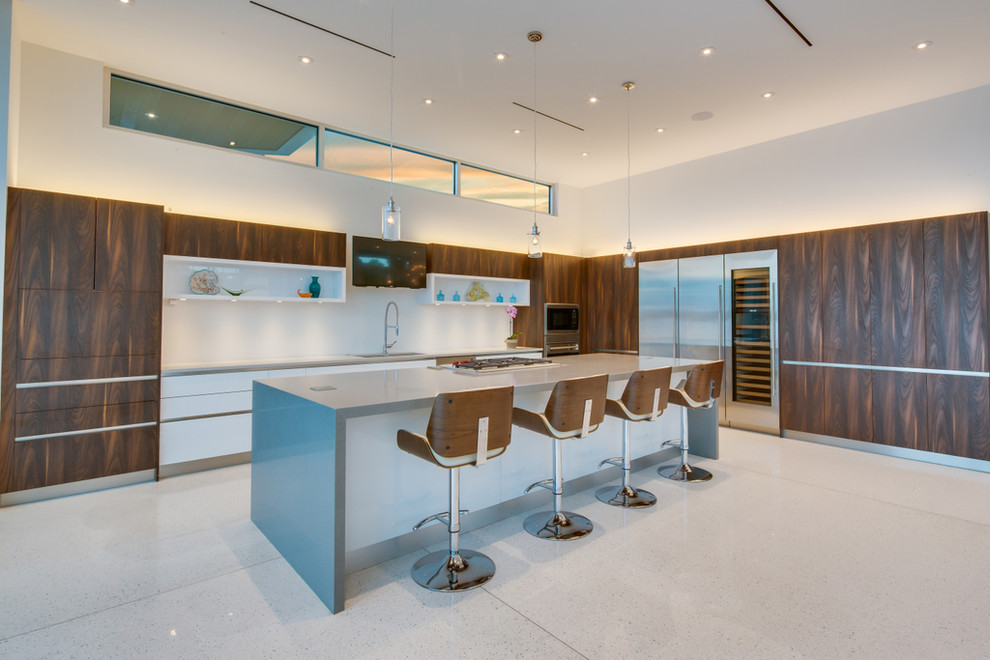 Inspiration for a large modern marble floor kitchen remodel with dark wood cabinets, marble countertops, white backsplash and an island