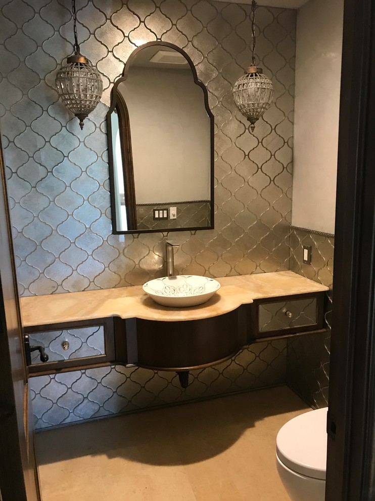 Design ideas for a large traditional powder room in Orange County with gray tile, metal tile, grey walls, marble floors, a vessel sink, marble benchtops, brown floor and beige benchtops.