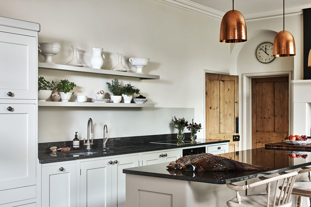 Design ideas for a rural kitchen in Surrey with recessed-panel cabinets, granite worktops and an island.
