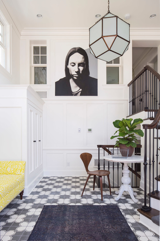Inspiration for a traditional foyer in Minneapolis with white walls.