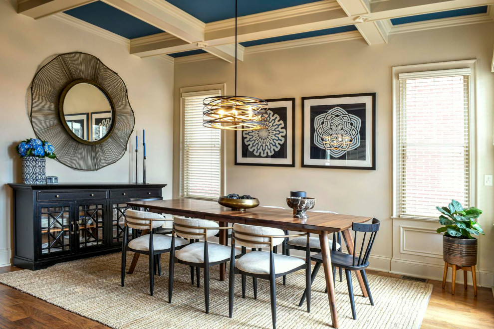 Inspiration for a transitional dining room in Louisville with beige walls, medium hardwood floors, brown floor and coffered.
