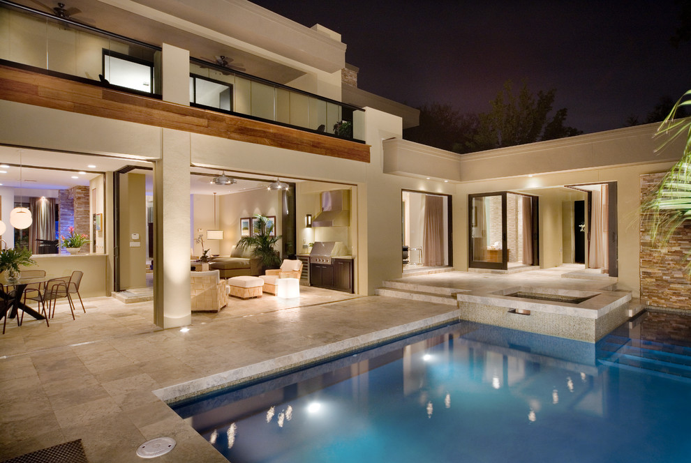 Contemporary courtyard custom-shaped pool in Orlando with a water feature.